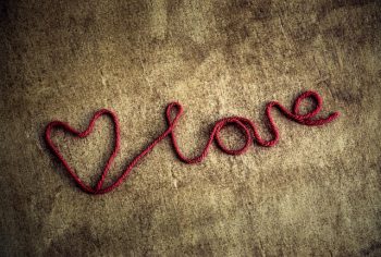 Cursive text of the word LOVE, with a heart